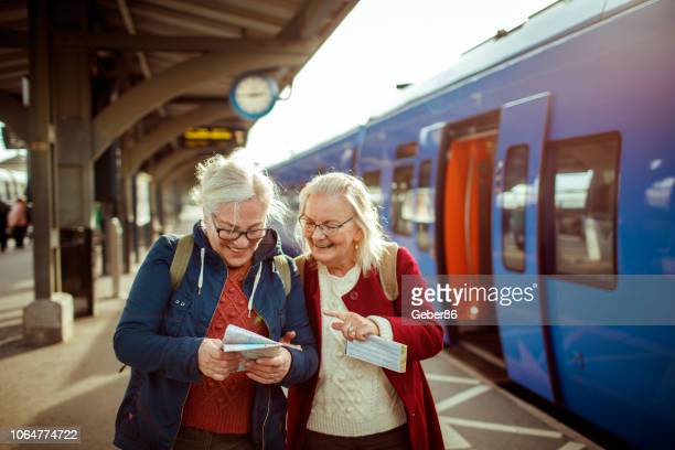 Close up of two seniors at a trainstation